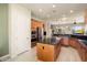 Well-equipped kitchen with island and stainless steel appliances at 20642 N 268Th Dr, Buckeye, AZ 85396