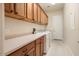 Bright laundry room with washer, dryer, and ample cabinetry at 20642 N 268Th Dr, Buckeye, AZ 85396