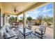 Covered patio furniture overlooking the desert landscape at 20642 N 268Th Dr, Buckeye, AZ 85396