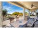 Covered patio with seating area and desert landscaping at 20642 N 268Th Dr, Buckeye, AZ 85396