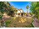 Expansive backyard featuring a patio, pool, and lush lawn, perfect for outdoor activities and relaxation at 211 E Dawn Dr, Tempe, AZ 85284