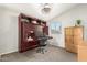 Comfortable bedroom with a built-in desk, ample storage, and a cozy atmosphere at 211 E Dawn Dr, Tempe, AZ 85284