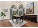 Dining room featuring a modern table, large windows, and a decorative sideboard at 211 E Dawn Dr, Tempe, AZ 85284