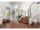 Bright entryway with hardwood floors, a staircase, and a front door with decorative glass detail at 211 E Dawn Dr, Tempe, AZ 85284