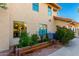 Exterior shot features a planter bed with lush plants, enhancing the home's outdoor appeal at 211 E Dawn Dr, Tempe, AZ 85284