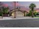 Charming two-story home with a three-car garage, well-manicured lawn, mature landscaping and tile roof at 211 E Dawn Dr, Tempe, AZ 85284