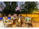 Cozy outdoor space with a fire pit, comfortable seating, and a lush garden creating an inviting ambiance at 211 E Dawn Dr, Tempe, AZ 85284