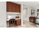 Functional home office area with built-in desk, cabinetry and drawers, with neutral color palette and natural light at 211 E Dawn Dr, Tempe, AZ 85284