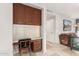 Functional home office area with built-in desk, cabinetry and drawers, with neutral color palette and natural light at 211 E Dawn Dr, Tempe, AZ 85284