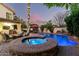 Backyard oasis with a pool, spa, and ample seating areas for outdoor entertaining at 211 E Dawn Dr, Tempe, AZ 85284