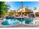 Sparkling backyard pool and spa area featuring a covered patio and a well-manicured landscape, ideal for outdoor living at 211 E Dawn Dr, Tempe, AZ 85284