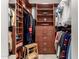 Spacious walk-in closet with built-in shelving, drawers, hanging rods, and a small wooden ladder at 211 E Dawn Dr, Tempe, AZ 85284