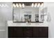 Double vanity bathroom with modern lighting and a walk-in shower at 23393 N 73Rd Way, Scottsdale, AZ 85255