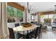 Elegant dining area with oval table and access to backyard at 23393 N 73Rd Way, Scottsdale, AZ 85255