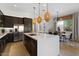 Spacious kitchen island with seating and stylish pendant lights at 23393 N 73Rd Way, Scottsdale, AZ 85255