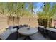 Private backyard patio with seating area and string lights at 23393 N 73Rd Way, Scottsdale, AZ 85255