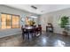 Inviting dining room with chandelier lighting, tile flooring, and large windows at 2637 S Sandstone St, Gilbert, AZ 85295