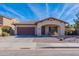 Charming single-story home with desert landscaping, covered porch, and a two-car garage at 2637 S Sandstone St, Gilbert, AZ 85295