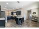 Well-equipped kitchen featuring stainless steel appliances, dark cabinetry, and an eat-in island at 2637 S Sandstone St, Gilbert, AZ 85295