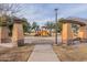 A vibrant playground with colorful equipment, shaded seating, and accessible paved walkways in a community park at 2637 S Sandstone St, Gilbert, AZ 85295