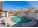 Backyard features a kidney-shaped pool, desert landscaping, and patio with partial privacy fencing at 2637 S Sandstone St, Gilbert, AZ 85295