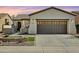 Single-story home with a two-car garage and landscaped front yard at 28107 N 123Rd Ln, Peoria, AZ 85383