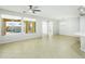 Living room with large windows and view of the backyard pool at 28107 N 123Rd Ln, Peoria, AZ 85383