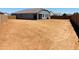 Large, spacious backyard with block fence, perfect for outdoor activities and entertaining at 28242 N Nealite Dr, San Tan Valley, AZ 85143