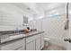 Bathroom boasts a double sink vanity with granite countertops and a shower/tub combination at 28242 N Nealite Dr, San Tan Valley, AZ 85143