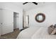 Bright bedroom showing the closet with sliding doors, and a sunburst mirror at 28242 N Nealite Dr, San Tan Valley, AZ 85143