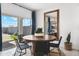 Inviting dining area featuring a round table, stylish chairs, and sliding glass doors leading to the patio at 28242 N Nealite Dr, San Tan Valley, AZ 85143