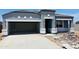 Charming single-story home featuring a two-car garage, and modern architectural details at 28242 N Nealite Dr, San Tan Valley, AZ 85143