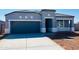 Charming single-story home featuring a two-car garage and a well-manicured front yard at 28242 N Nealite Dr, San Tan Valley, AZ 85143