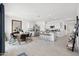 Open-concept living area with a modern kitchen, dining table, and tiled floors throughout the home at 28242 N Nealite Dr, San Tan Valley, AZ 85143