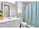 Clean bathroom with single vanity, shower, and window at 2885 W New River Dr, San Tan Valley, AZ 85144