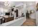 Bright open home entryway with tile floors, white columns and entry to an office at 3036 E Boston St, Gilbert, AZ 85295