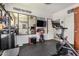 Well-equipped home gym with mirrored wall, fitness equipment, and motivational decor at 3036 E Boston St, Gilbert, AZ 85295