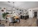 Spacious kitchen featuring a central island, dining table, stainless steel appliances and light gray cabinets at 3036 E Boston St, Gilbert, AZ 85295