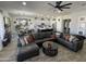 Relaxing living room showcasing a sectional sofa and a large TV at 3036 E Boston St, Gilbert, AZ 85295