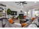 Bright living room featuring wood-look floors, a corner fireplace and large sectional sofa at 3036 E Boston St, Gilbert, AZ 85295