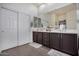 This main bathroom has dual sinks with a lot of storage underneath and nice countertops at 3036 E Boston St, Gilbert, AZ 85295