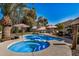 Inviting pool and spa combo with poolside seating, surrounded by lush landscaping at 3036 E Boston St, Gilbert, AZ 85295