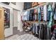 The walk-in closet features custom storage and shelving for clothes, shoes, and accessories at 3036 E Boston St, Gilbert, AZ 85295