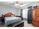 Bright bedroom featuring a queen-size bed and ample closet space at 3125 W Waltann Ln, Phoenix, AZ 85053