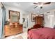 Bedroom with antique furniture and a view into the bathroom at 3125 W Waltann Ln, Phoenix, AZ 85053