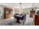 Bright dining room features a spacious table, wood cabinetry, and stone fireplace at 3125 W Waltann Ln, Phoenix, AZ 85053