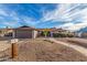 Ranch style home with a two-car garage and landscaped front yard at 3125 W Waltann Ln, Phoenix, AZ 85053