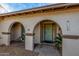 Front entry with arched walkways and light teal door at 3125 W Waltann Ln, Phoenix, AZ 85053