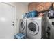 Laundry room with washer, dryer, and extra storage at 3125 W Waltann Ln, Phoenix, AZ 85053