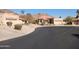 Houses with tan stucco and tile roofs in a desert setting at 3626 E Thunderhill Pl, Phoenix, AZ 85044